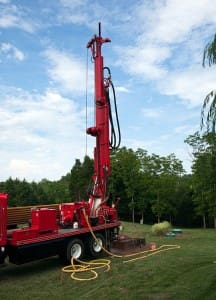 Well Drilling Rig at work in a clearing