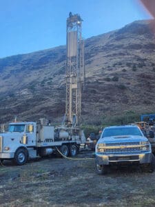 Work truck next to drill truck